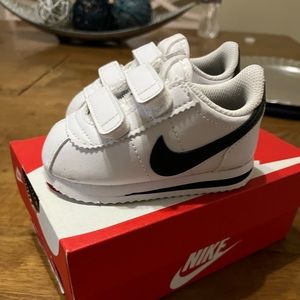 White and black toddler Nike Cortez